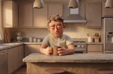 Image of coffee for a hangover — a claymation man cradling a mug of coffee the morning after.