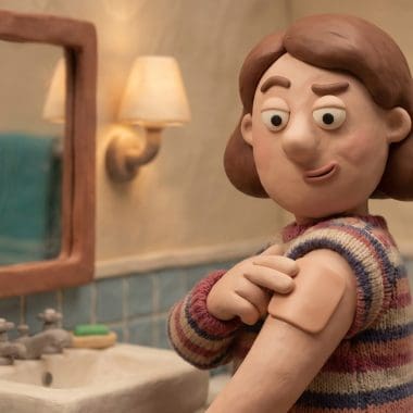 Image of a hangover patch — a claymation woman skeptically applying a small square patch to her arm before a night out.