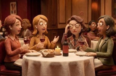 Image of red wine headache — four women at a restaurant dinner table in Aardman claymation style, three laughing and enjoying wine while one presses her hand to her temple with a pained expression.
