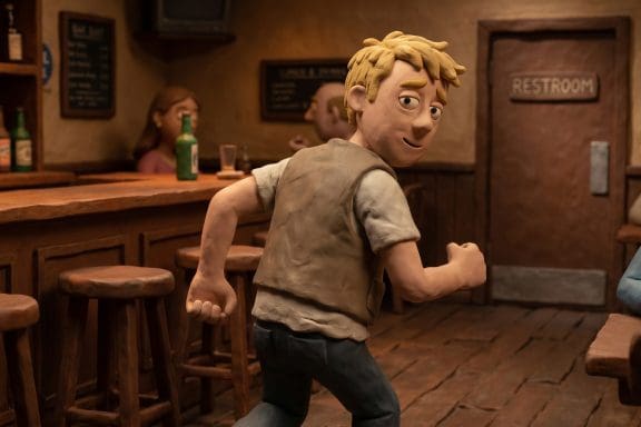 Image of why alcohol makes you pee — a claymation man hurrying to the bar restroom.